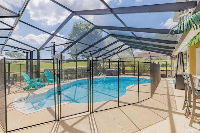 view of pool with a patio and a lanai