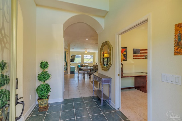 hallway featuring dark tile patterned flooring