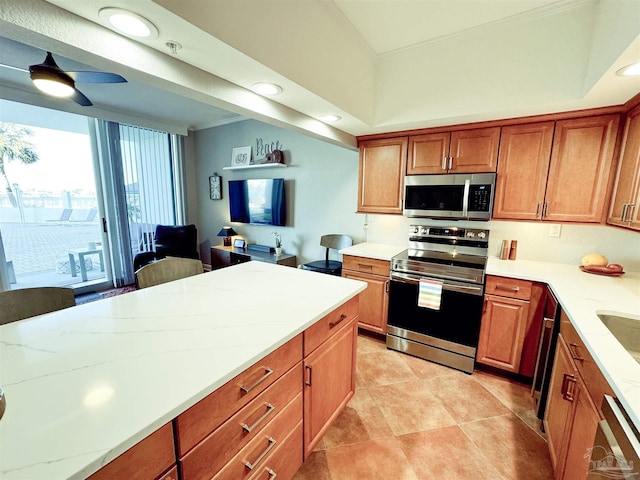 kitchen featuring recessed lighting, stainless steel appliances, ornamental molding, and brown cabinetry