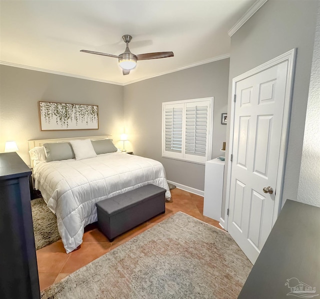 tiled bedroom with ceiling fan and ornamental molding