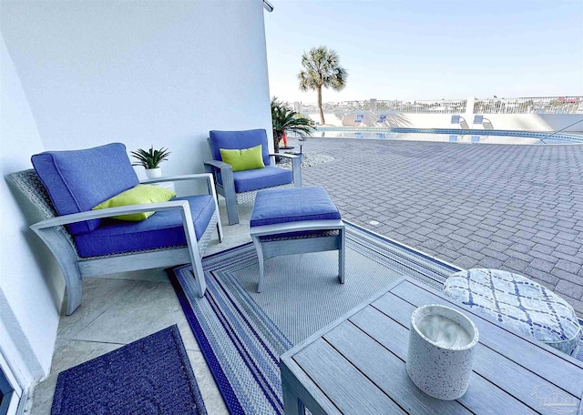 view of patio / terrace featuring an outdoor pool and an outdoor hangout area