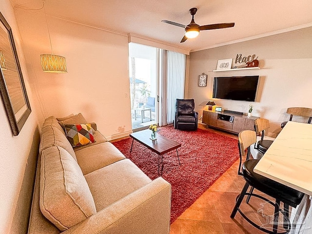 tiled living room with ceiling fan, ornamental molding, and floor to ceiling windows