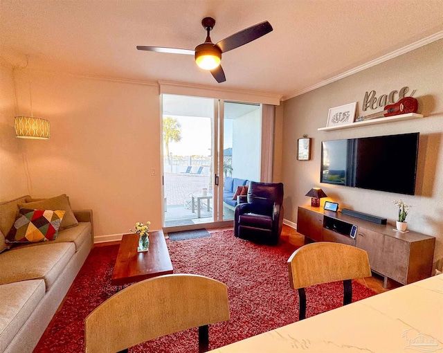 living area featuring baseboards, ceiling fan, floor to ceiling windows, ornamental molding, and wood finished floors