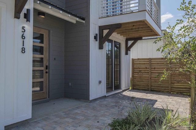 entrance to property with a patio