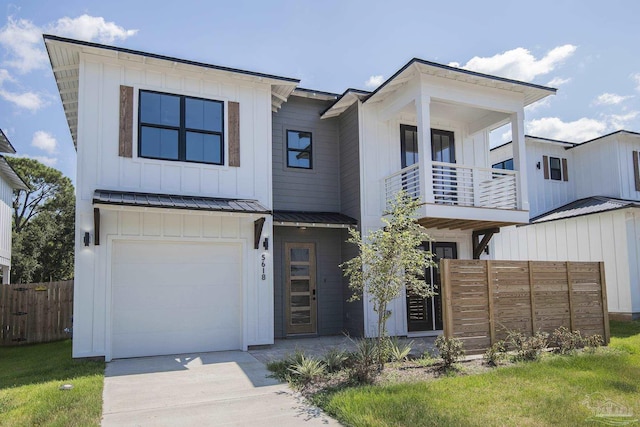 view of front of property featuring a garage and a balcony