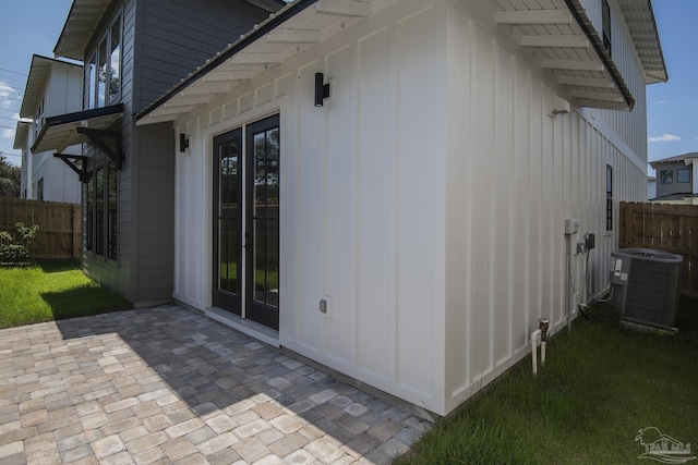 view of home's exterior featuring a patio area and central air condition unit