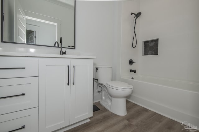 full bathroom featuring vanity, wood-type flooring, toilet, and shower / bath combination