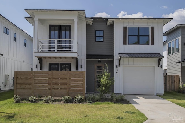 view of front of house with a garage and a front yard