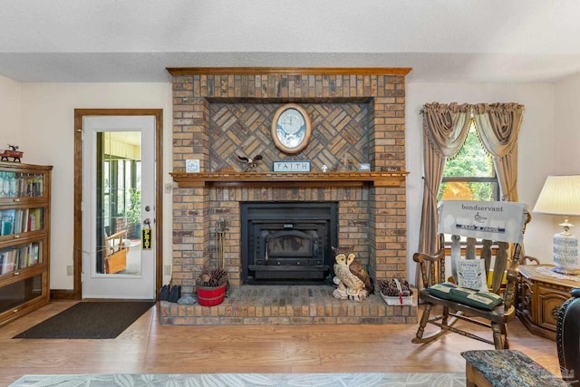 5816 Forest Ridge Dr, Pensacola, FL 32526 - living area featuring wood finished floors, a textured ceiling, and baseboards
