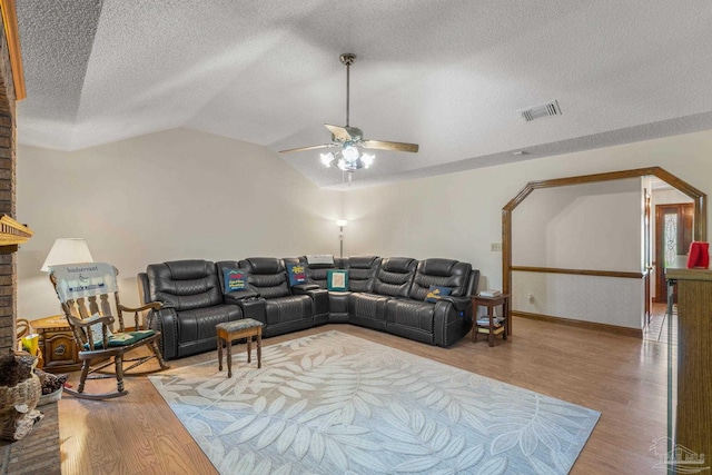 5816 Forest Ridge Dr, Pensacola, FL 32526 - living room with wood finished floors, a textured ceiling, ceiling fan, vaulted ceiling, and baseboards