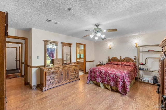 5816 Forest Ridge Dr, Pensacola, FL 32526 - bedroom featuring light wood-style flooring, a textured ceiling, and ceiling fan