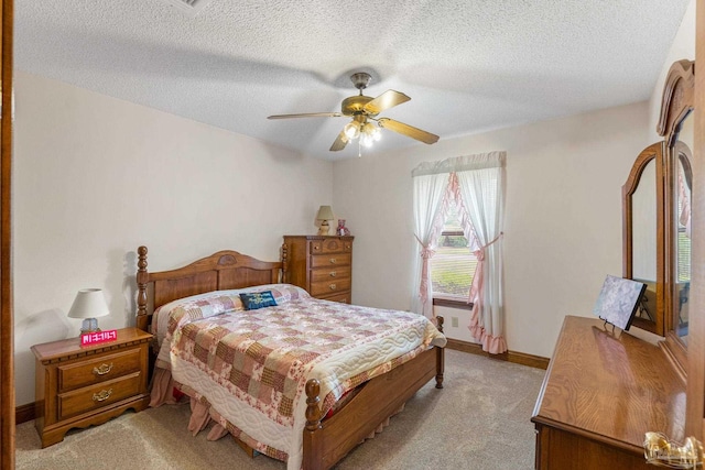 5816 Forest Ridge Dr, Pensacola, FL 32526 - bedroom featuring light colored carpet, a textured ceiling, ceiling fan, and baseboards