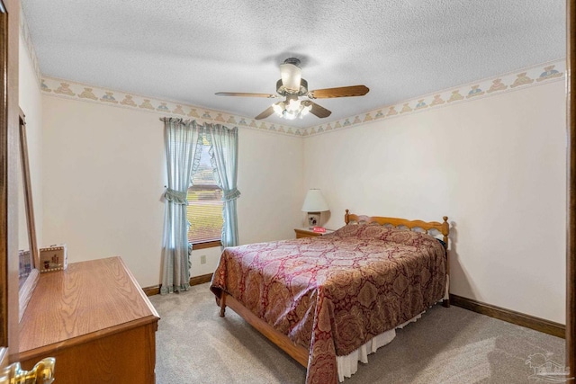 5816 Forest Ridge Dr, Pensacola, FL 32526 - bedroom featuring light colored carpet, a textured ceiling, baseboards, and ceiling fan