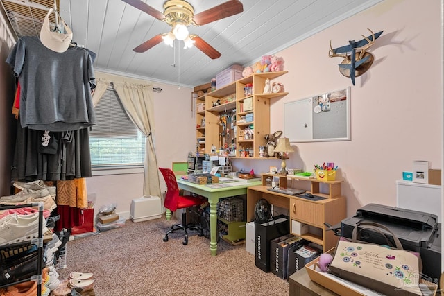 carpeted home office featuring ornamental molding, wood ceiling, and a ceiling fan