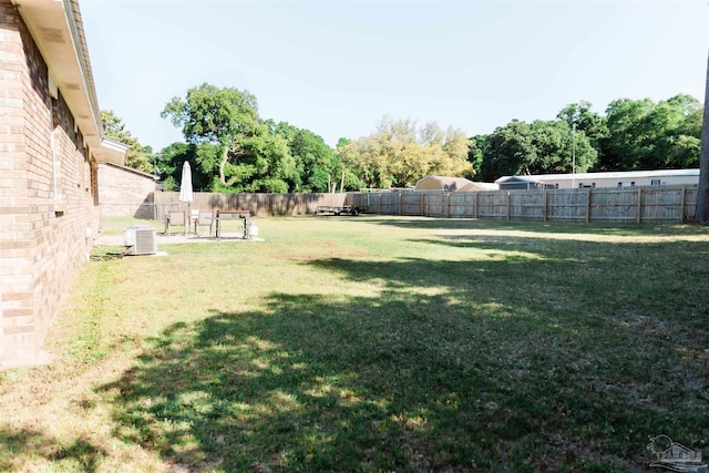 view of yard with central AC unit