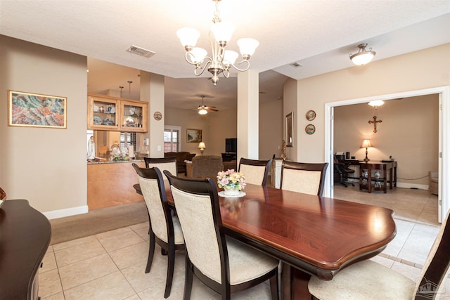 2255 Reed Ridge Ct, Navarre, FL 32566 - dining room featuring ceiling fan with notable chandelier, light colored carpet, visible vents, light tile patterned floors, and baseboards