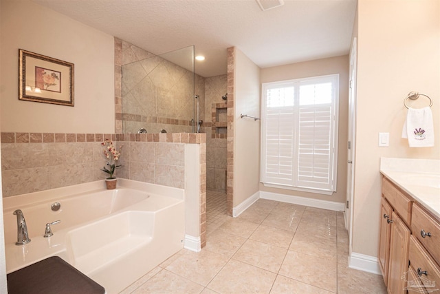 2255 Reed Ridge Ct, Navarre, FL 32566 - full bathroom featuring a garden tub, tile patterned floors, baseboards, walk in shower, and vanity