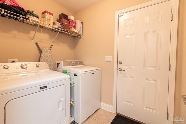 2255 Reed Ridge Ct, Navarre, FL 32566 - laundry area with laundry area, light tile patterned floors, and washing machine and dryer