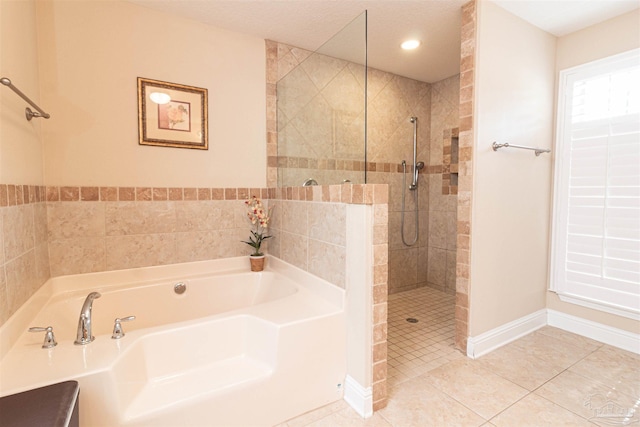 2255 Reed Ridge Ct, Navarre, FL 32566 - bathroom with baseboards, walk in shower, tile patterned floors, and a bath