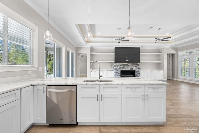 kitchen with white cabinets, stainless steel dishwasher, and sink