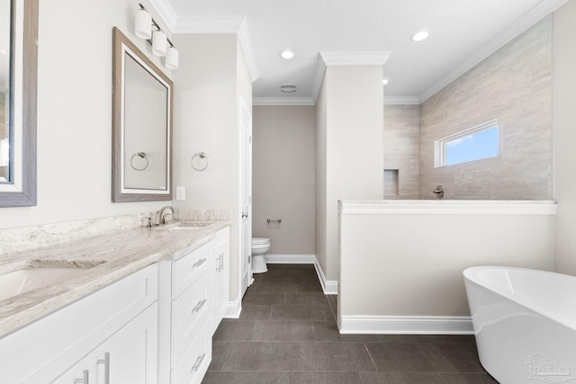 bathroom with a bath, vanity, ornamental molding, and toilet