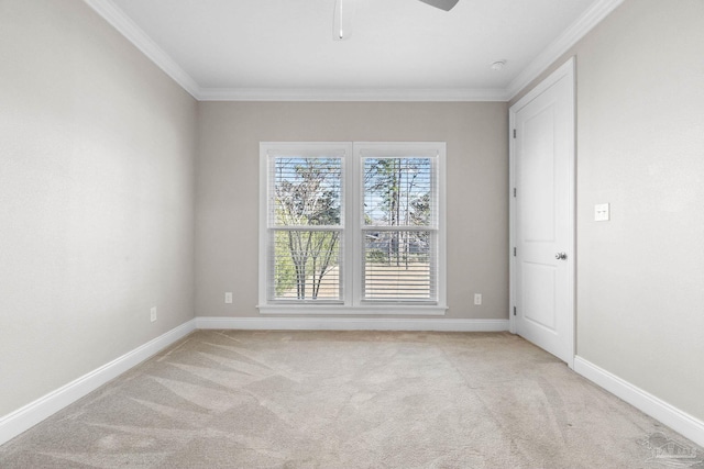 carpeted spare room with crown molding and ceiling fan