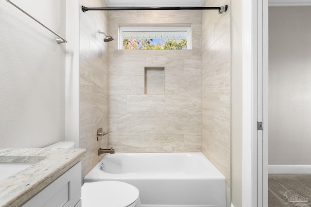 full bathroom featuring vanity, toilet, and tiled shower / bath