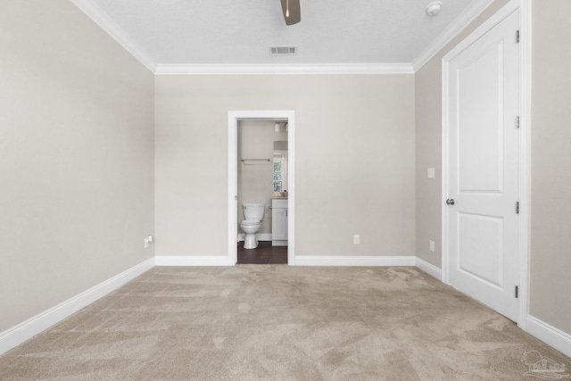 unfurnished bedroom with ceiling fan, light colored carpet, and ornamental molding