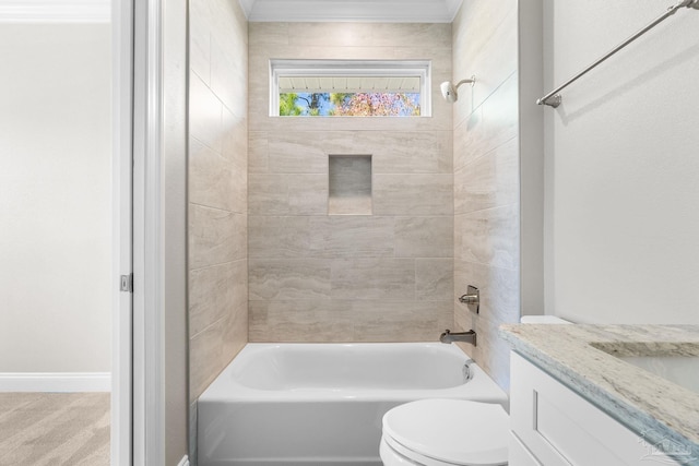 full bathroom featuring toilet, vanity, and tiled shower / bath