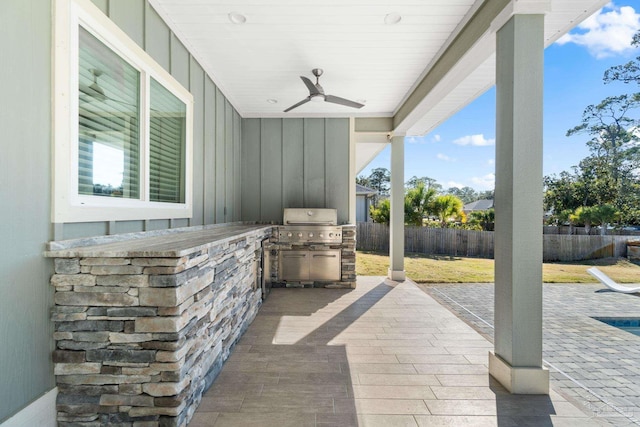 view of patio / terrace with ceiling fan, area for grilling, and grilling area