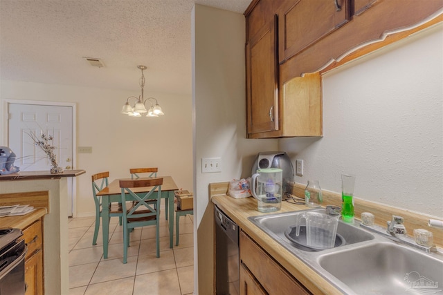 kitchen featuring light tile patterned flooring, sink, a textured ceiling, dishwasher, and pendant lighting