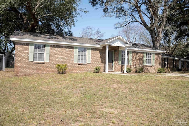 ranch-style home with a front lawn