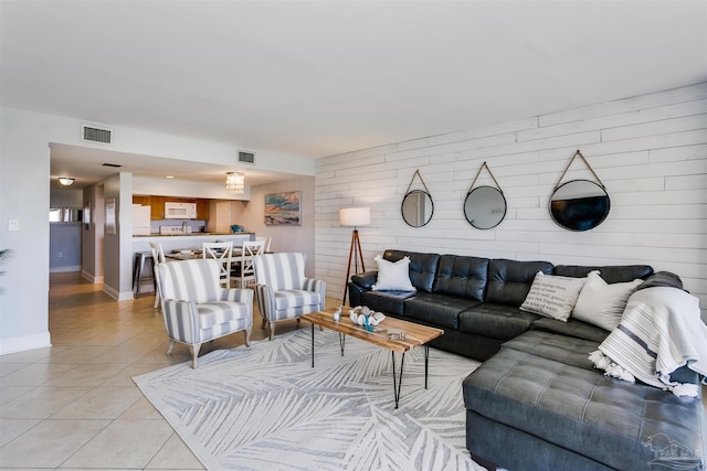 tiled living room with wood walls