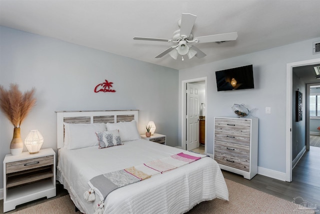 bedroom with ceiling fan and hardwood / wood-style flooring