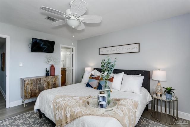 bedroom with ceiling fan and dark hardwood / wood-style floors