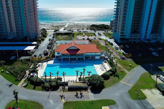 drone / aerial view with a water view and a view of the beach