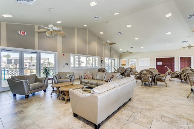 living room featuring high vaulted ceiling and ceiling fan