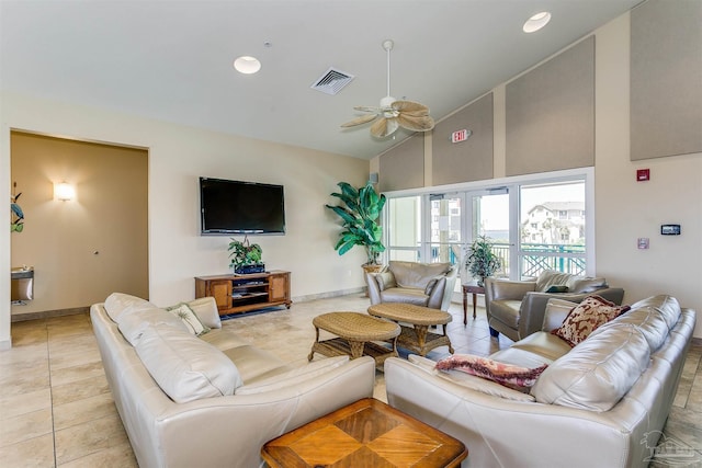 living room featuring ceiling fan, high vaulted ceiling, and light tile patterned flooring