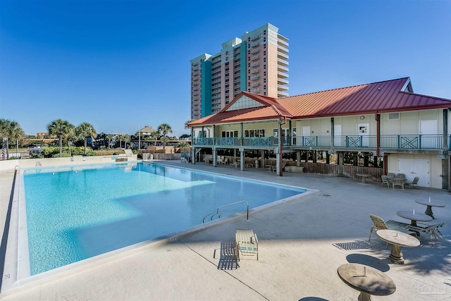 view of swimming pool with a patio area