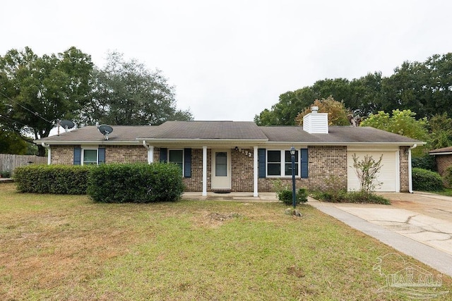 single story home featuring driveway, a chimney, an attached garage, a front lawn, and brick siding