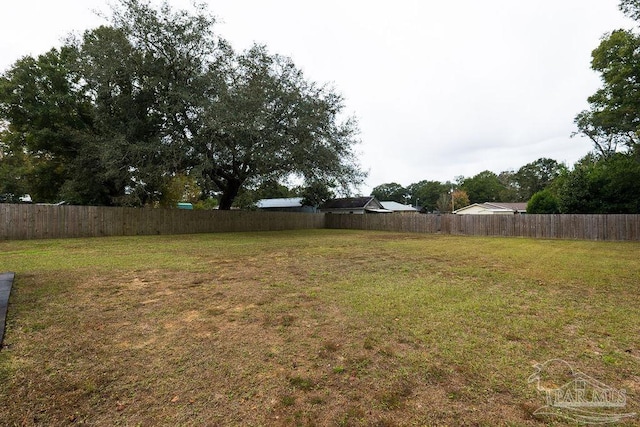 view of yard featuring a fenced backyard