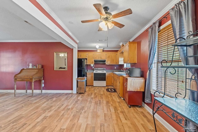 kitchen featuring black fridge, white stove, extractor fan, and crown molding