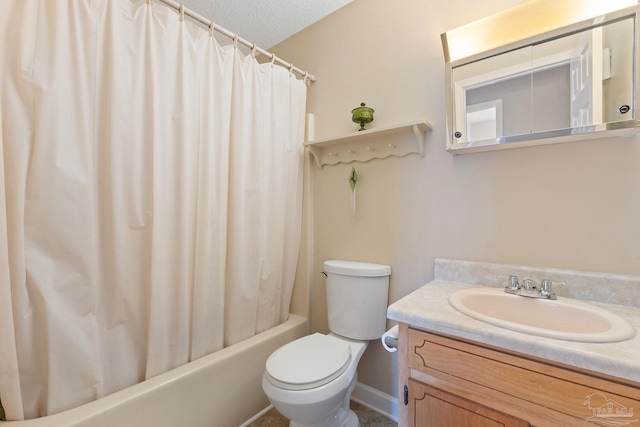 full bathroom featuring shower / bath combo, vanity, a textured ceiling, and toilet