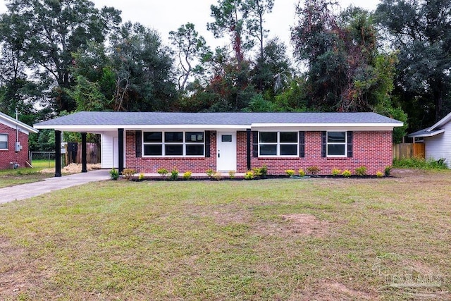 ranch-style house featuring a carport and a front yard