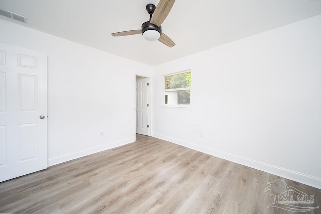 empty room featuring ceiling fan and light hardwood / wood-style floors