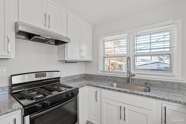 kitchen featuring white cabinetry, light stone countertops, sink, and stainless steel gas range