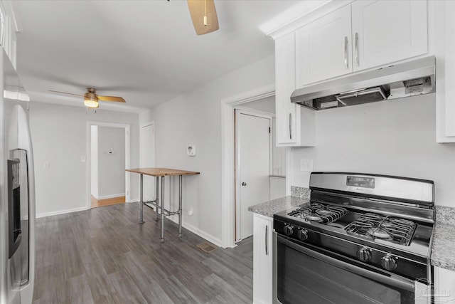 kitchen with stainless steel refrigerator with ice dispenser, light stone countertops, black gas range oven, and white cabinets