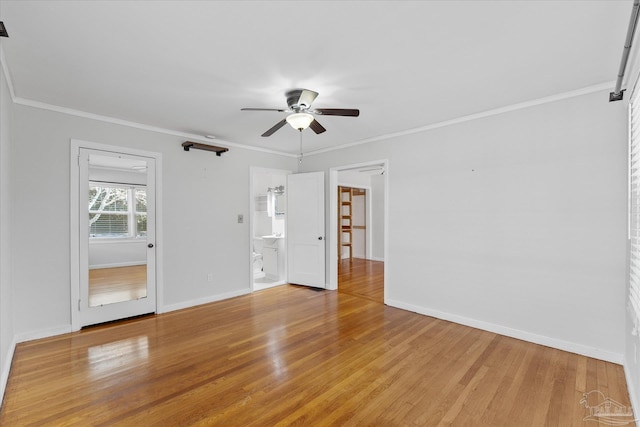 unfurnished room featuring hardwood / wood-style flooring, ornamental molding, and ceiling fan