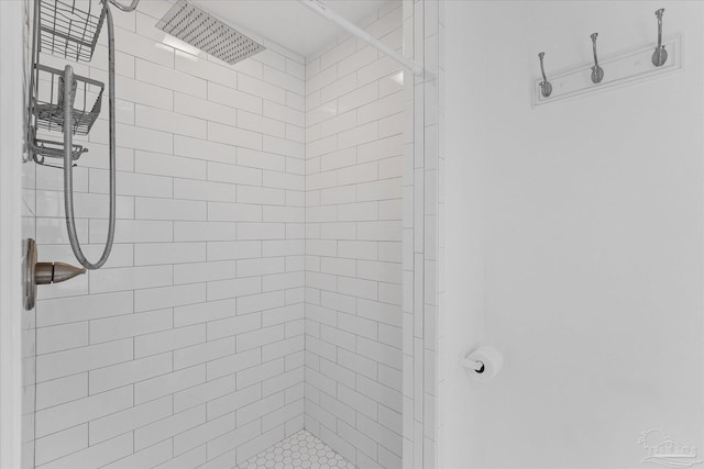 bathroom with a tile shower