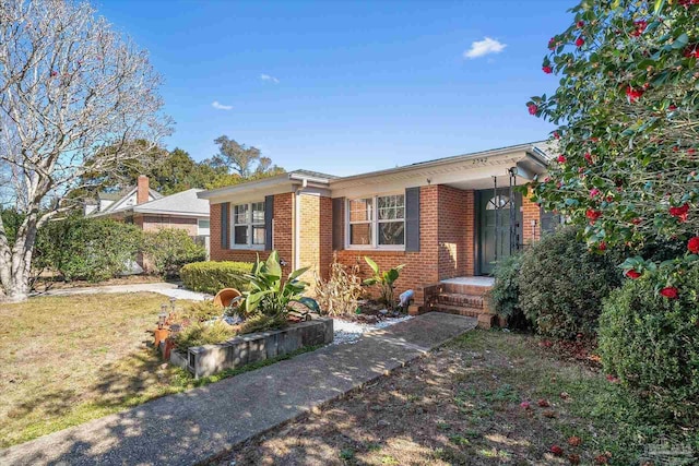 ranch-style house with a front lawn